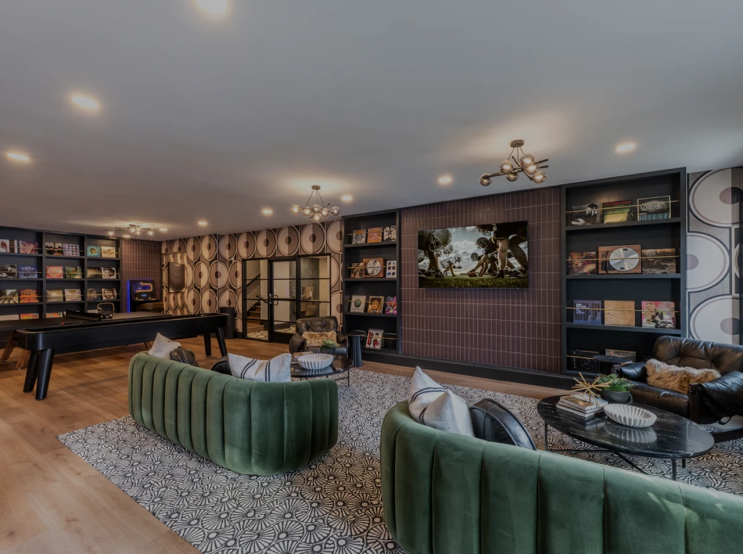 Three friends laugh around a grill on a summer afternoon