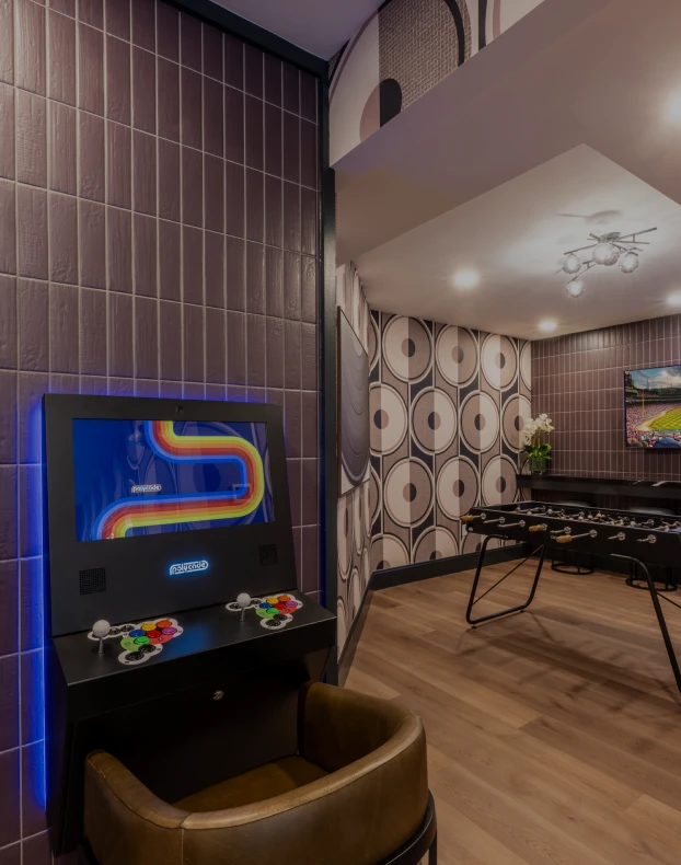 Three friends laugh around a grill on a summer afternoon