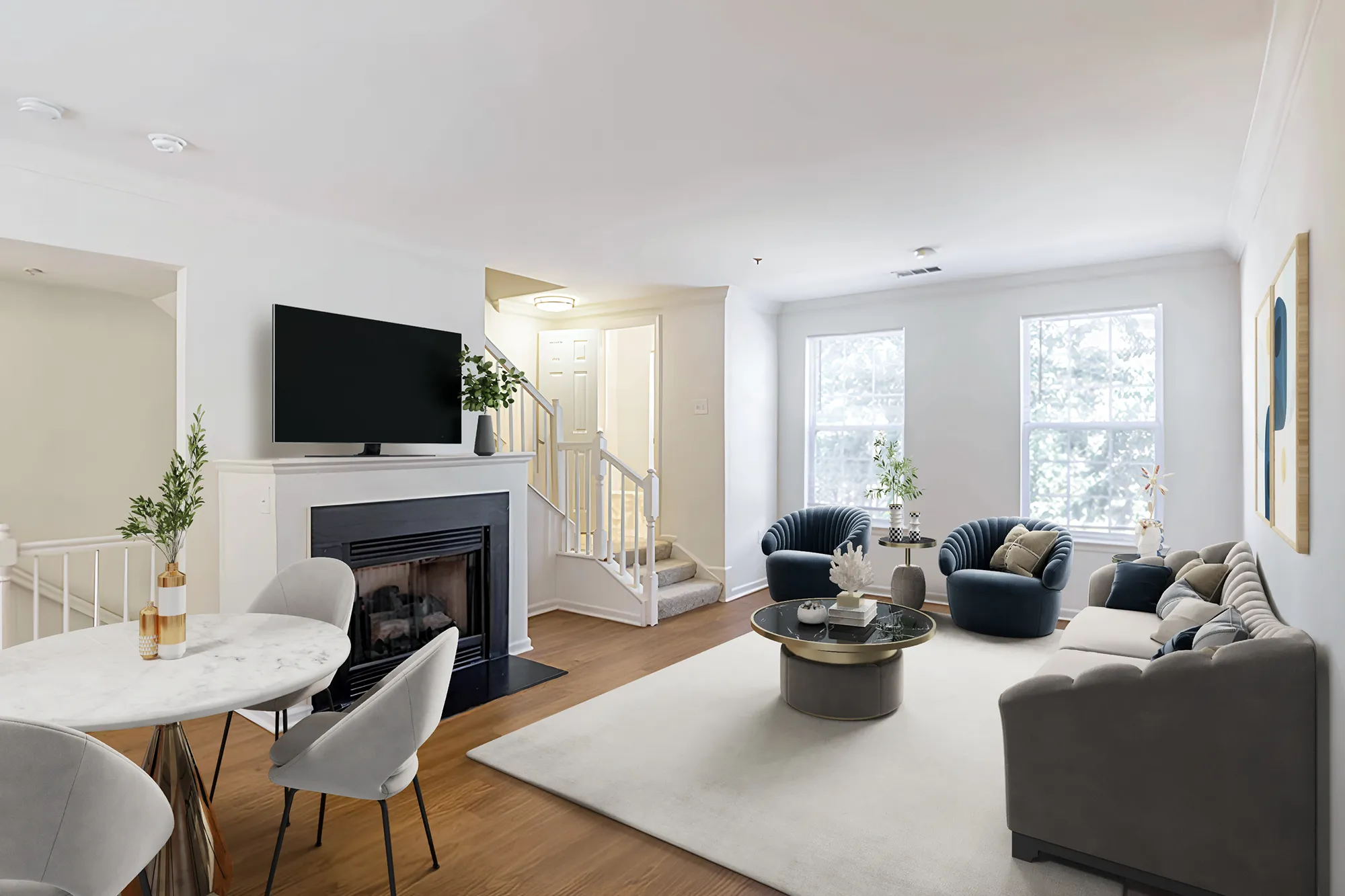 Modern apartment living room with fireplace, mounted television, stylish furniture, and natural light from windows