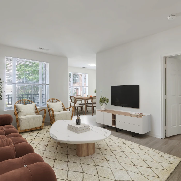 Stylish apartment living room with plush sofa, modern coffee table, and large flat-screen